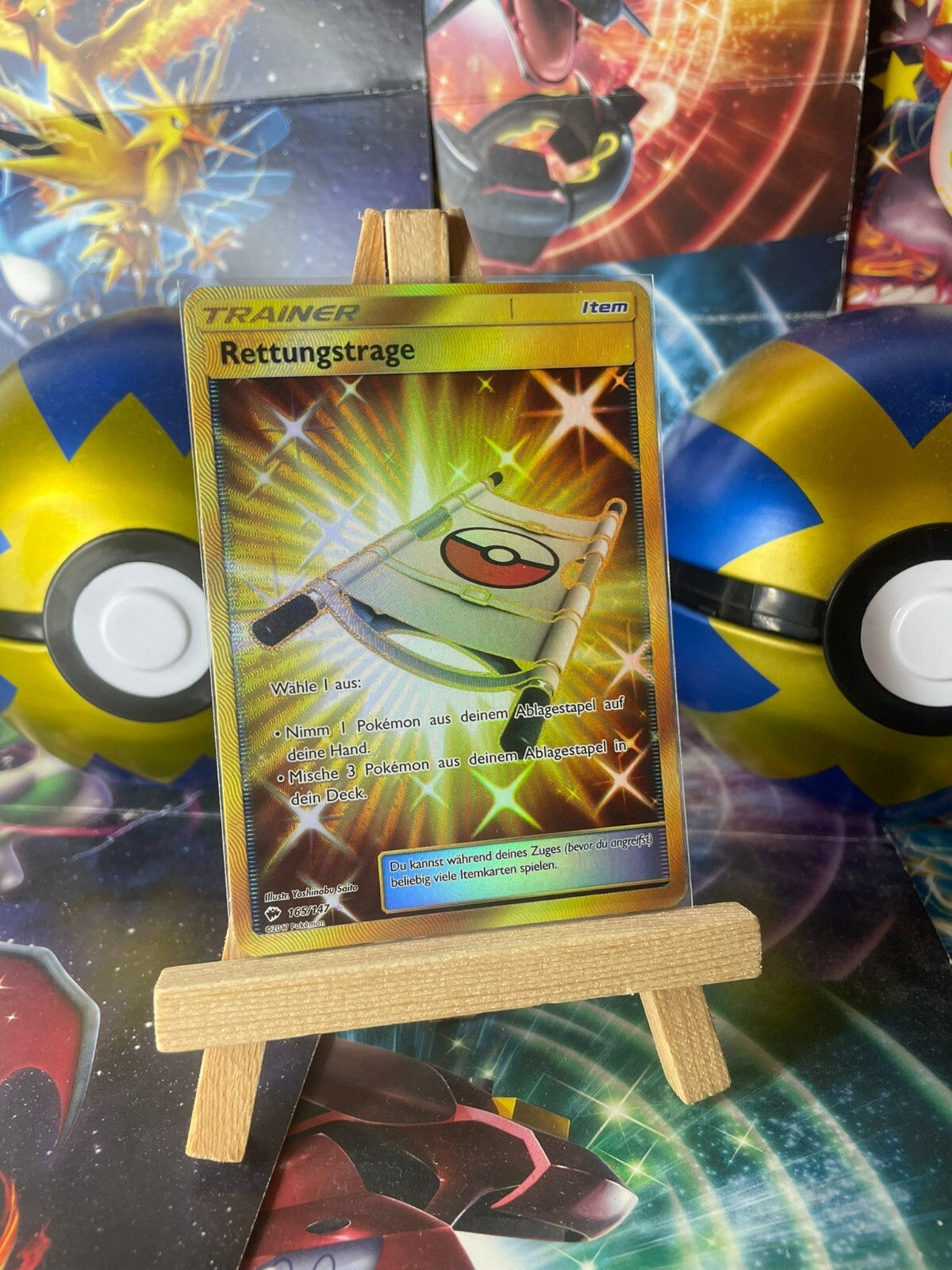 Pokémon Karte Rettungstrage 165/147 Gold Trainer DE PSA GD Nacht in Flammen